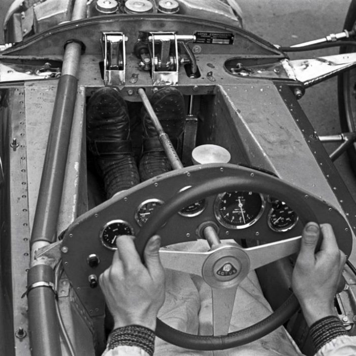 Jim-Clark-with-his-feet-on-two-of-the-Lotus-25-F1-cars-three-pedals-1024x683