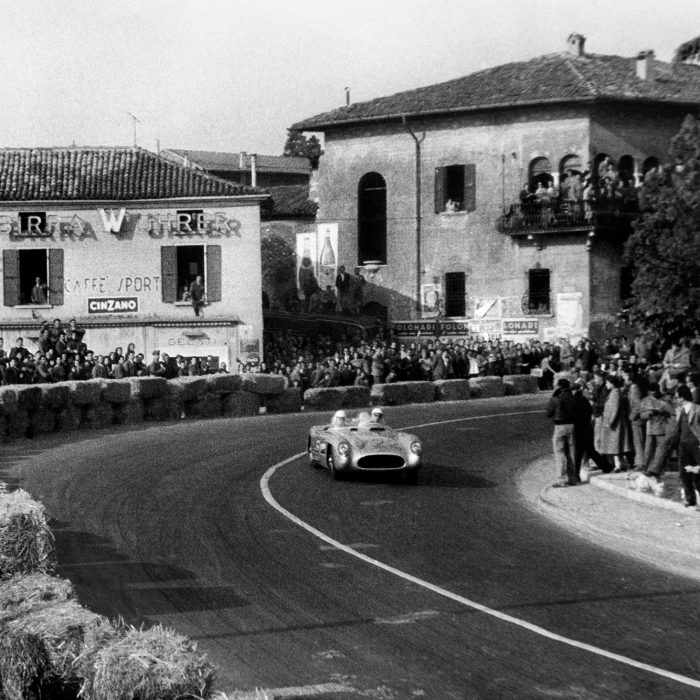 Stirling-Moss-and-Denis-Jenkinson-race-through-another-Italian-town-1955-Mille-Miglia-Italy